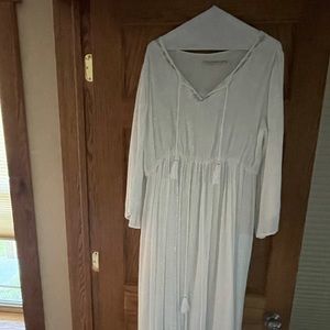 Long white dress with silver threading.  Never worn.